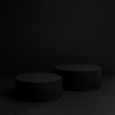 Abstract black scene with two cylinder podiums template for presentation cosmetic products, goods, advertising, design, poster, text, card in soft gradient, abstract mockup in beauty luxury style.の写真素材