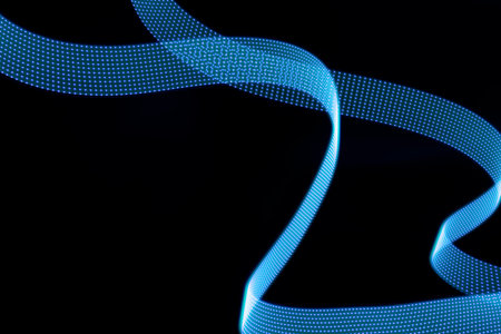 Blue glow neon curved wave of light as curls with dotted stripes on black background, pattern....