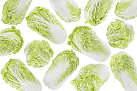Bright vegetables pattern of green chinese cabbage, isolated. Green chinese cabbage, whole head, leaves fly, isolated. Great for farm-fresh produce, culinary advertising, design, organic menu.の写真素材