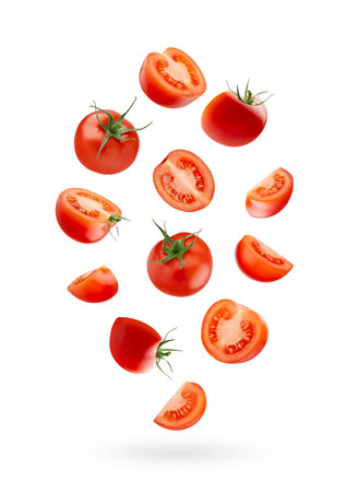 Bright red cherry tomatoes - whole, sliced levitation as swirl in art composition, isolated white background. Vegetarian diet food for detox cooking, fitness diet, label product.の写真素材