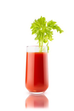 Red fresh tomato juice in glass with celery sprig garnish, isolated, white background. Healthy vitamin cocktail for detox antioxidant diet program, fitness menu, wholesome homemade cuisine, superfood.の写真素材