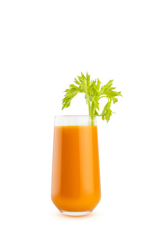 Fresh carrot juice garnished with fresh green celery, in glass, closeup, isolated on white background. Healthy organic drink for design of detox diet menu, cuisine or restaurant.の写真素材