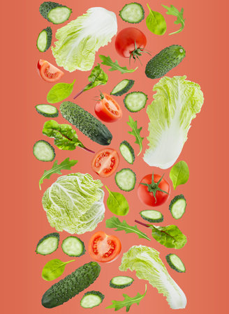 Healthy eating background. Fresh vegetables as DNA spiral. Salad ingredients - cabbage, tomatoes, cucumber, leafy greens fly on red background. Great for farm-fresh produce, culinary advertising.の写真素材