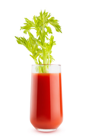 Bright red fresh vegetable pulpy tomato juice or bloody mary cocktail in glass with vibrant celery stalk garnish, isolated. Vitamin smoothie for healthy fitness menu, diet program, detox cuisine.の写真素材