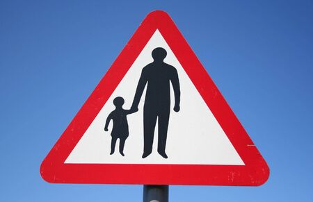 Warning pedestrians on road signの写真素材