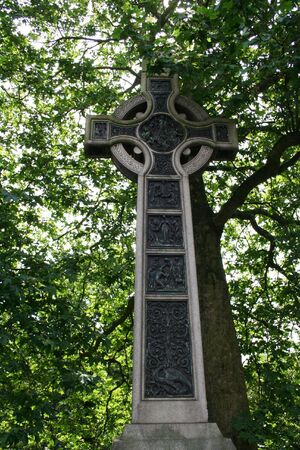 Celtic cross against treesの写真素材