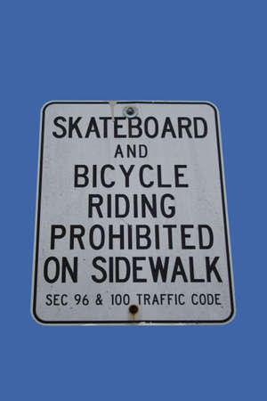 skateboards and bicycles riding prohibited riding on sidewalkの写真素材