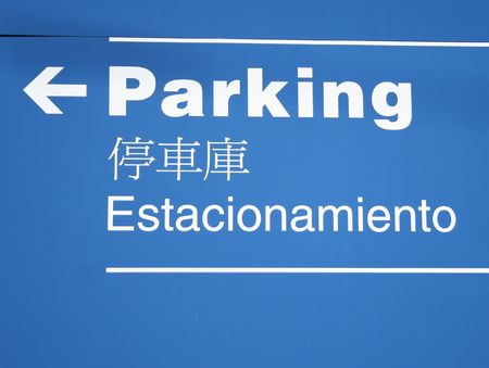 Trilingual parking sign English Spanish and Chineseの写真素材
