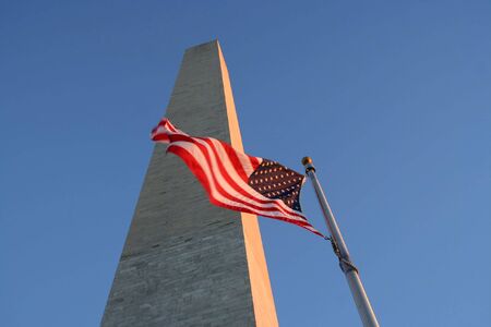 Washington monument and American flagの写真素材