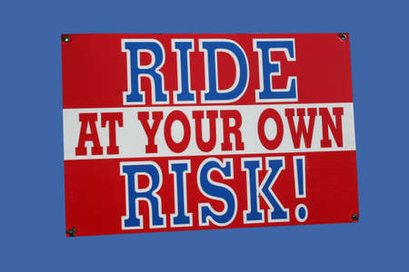 ride at your own risk signの写真素材