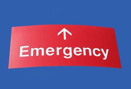 red emergency sign with arrow pointing aheadの写真素材