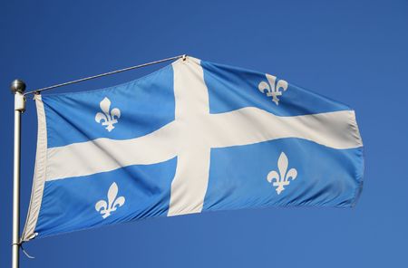flag of Quebec white cross and emblem on blue backgroundの写真素材