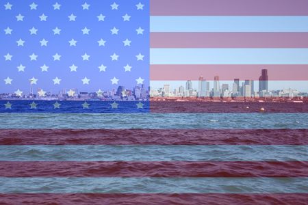 Seattle skyline Puget Sound and American flag montageの写真素材