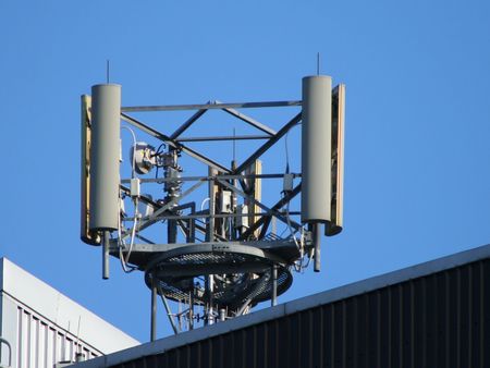 Mobile phone mast on top of building