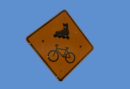 Attention Cyclists and rollerbladers sign on blueの写真素材