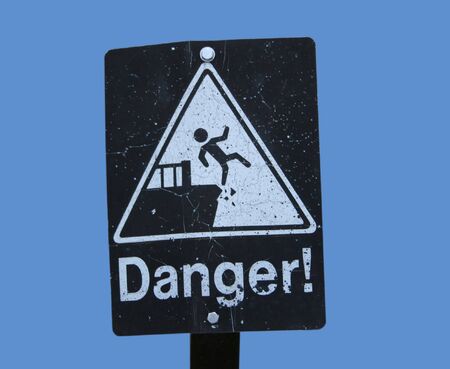 Danger cliff sign with figure fallingの写真素材