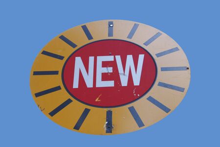 Attention new road sign isolated on blueの写真素材