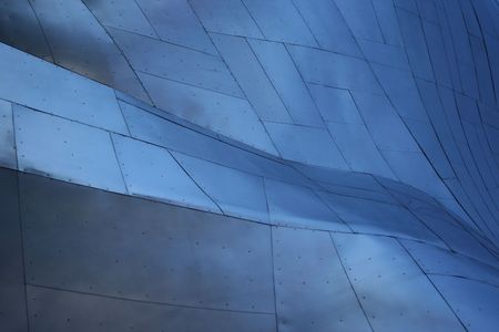 futuristic metal background curved surface with rivetsの写真素材