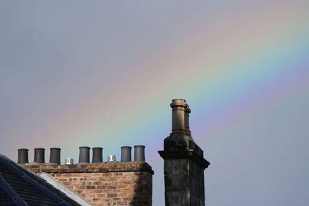 rainbow and chimney pots on an overcast dayの写真素材