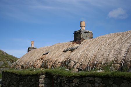 old buildings with thatched roof Blackhouse village Isle of Lewis Scotlandの写真素材