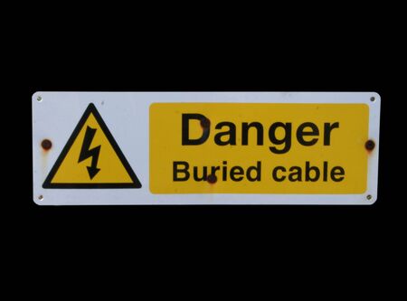 danger buried cable sign isolated on black