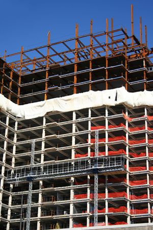 metal frame of skyscraper under construction