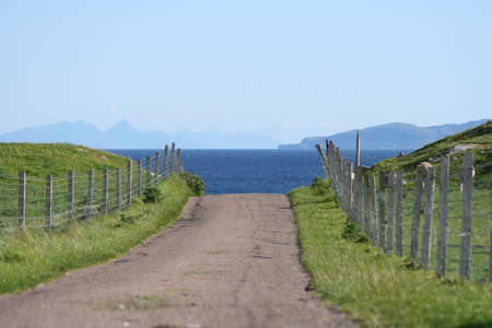 road leading to sea island of Iona Scotlandの写真素材