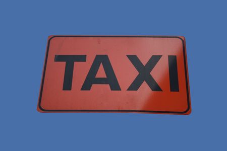 Taxi cabs only sign isolated on blueの写真素材