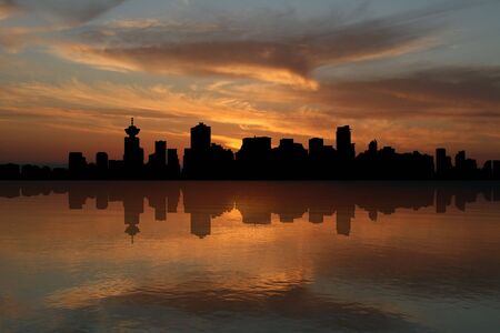 Vancouver skyline at sunset reflected in water illustrationの写真素材