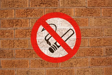 No smoking sign painted on brick wallの写真素材
