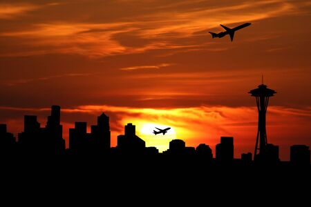 plane taking off at sunrise and Seattle skyline illustrationの写真素材
