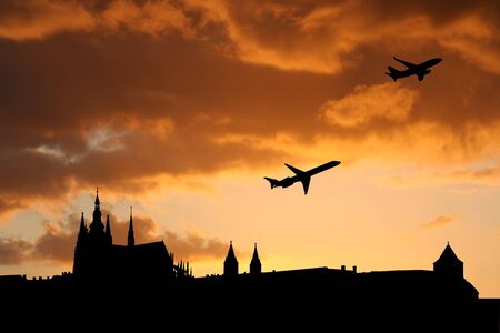 planes departing Prague with St Vitus cathedral and castleの写真素材
