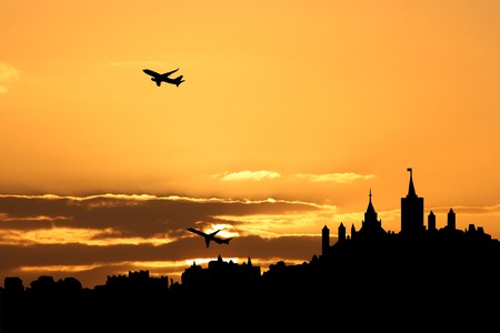 planes departing with Ottawa skyline at sunsetの写真素材