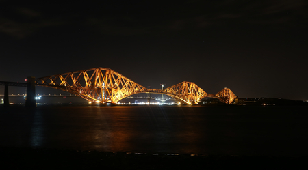 Forth Rail Bridge illuminated at night Scotlandの写真素材