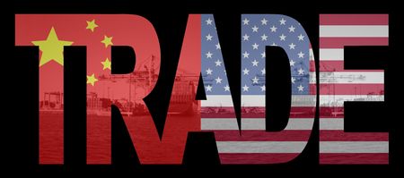 Trade text with chinese and American flags over container ships at portのeditorial素材