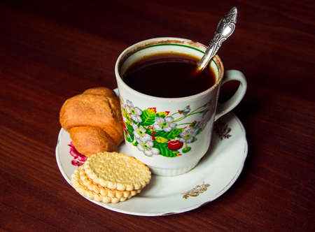 Cup of coffee on a plate in soviet styleの写真素材