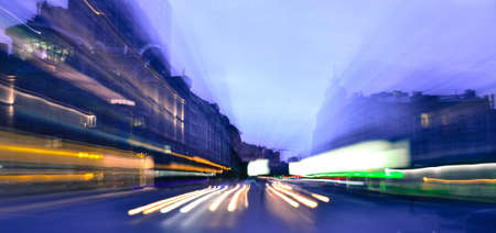 Evening city traffic lights speed blurred motionの写真素材