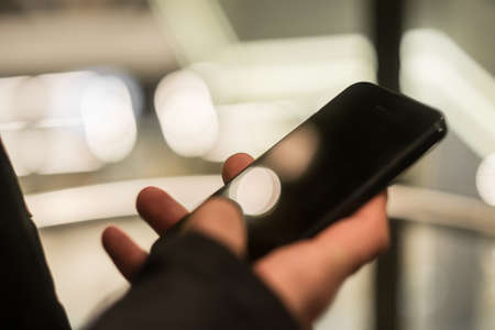 Man using smart phone close up. Mobile phone in male handの写真素材