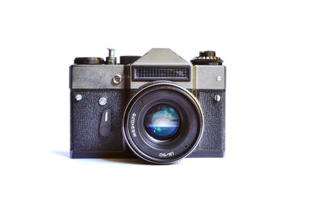 Retro film photo camera isolated over white backgroundの写真素材