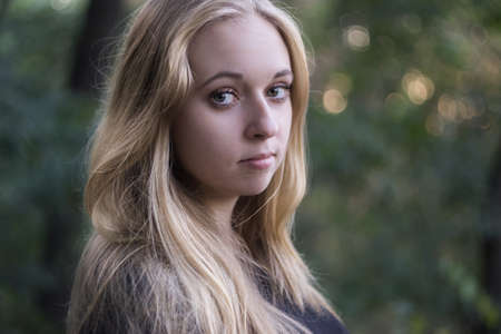 Portrait of a beautiful young woman with long blond hairの写真素材