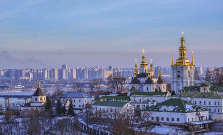 Panoramic view of Kiev Pechersk Lavra Christian Monastery in winter. The Dnieper River, Church of the Nativity of the Virgin Mary, Bell tower at the Far Caves. Ukrainian baroque, 18th centuryの写真素材