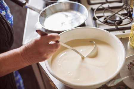 Grandmother making pancakesの写真素材