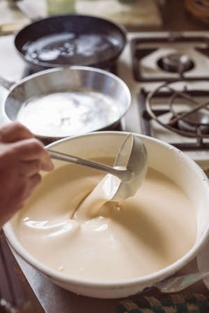 Grandmother making pancakesの写真素材