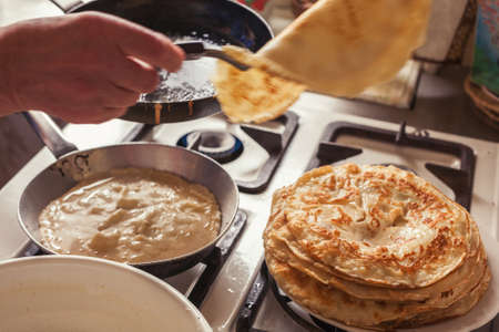 Grandmother making pancakesの写真素材