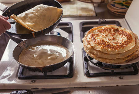 Grandmother making pancakesの写真素材