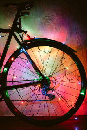Bicycle decorated with Christmas lightsの写真素材