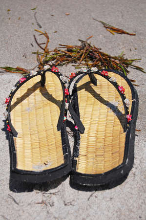 flip flops on the beachの写真素材