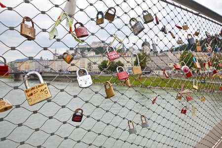 SALZBURG, AUGUST 13   Padlocks on bridge in Salzburg, Austria, August 13, 2013  Lovelocks are left by sweethearts on bridges to symbolise their love, a global craze which started in the early 2000s  のeditorial素材