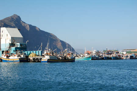 HOUT BAY, SOUTH AFRICA - AUGUST 19  Fishing boats in Hout Bay Harbour near Cape Town, South Africa on August 19, 2008  Hout Bay is a historic working fishing village のeditorial素材