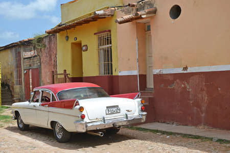 Trinidad - July 27: classic American car in the historic town of Trinidad, Cuba on July 27, 2014. Until  2011, Cubans were only allowed to own vehicles registered before the Revolution in 1959.のeditorial素材